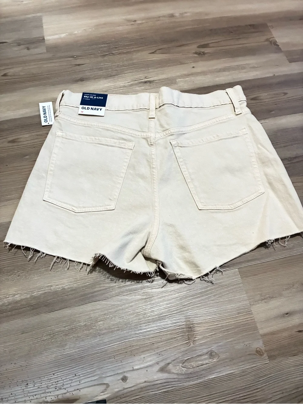 Old Navy Sky-hi A-line 3” denim short Ecru Size 12 Hidden button fly Raw hem NWT